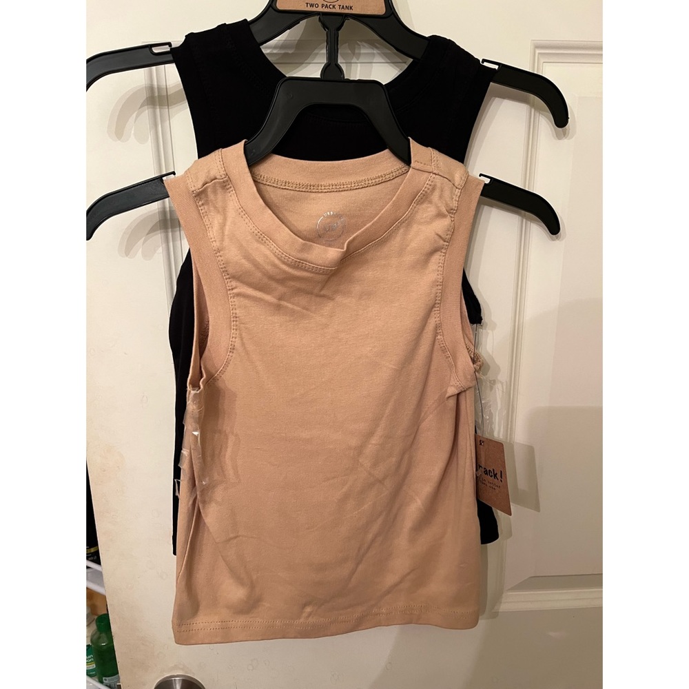 Two tank tops with tags